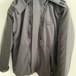 Boys 18-20/Men’s small black Reebok layered jacket new without tags